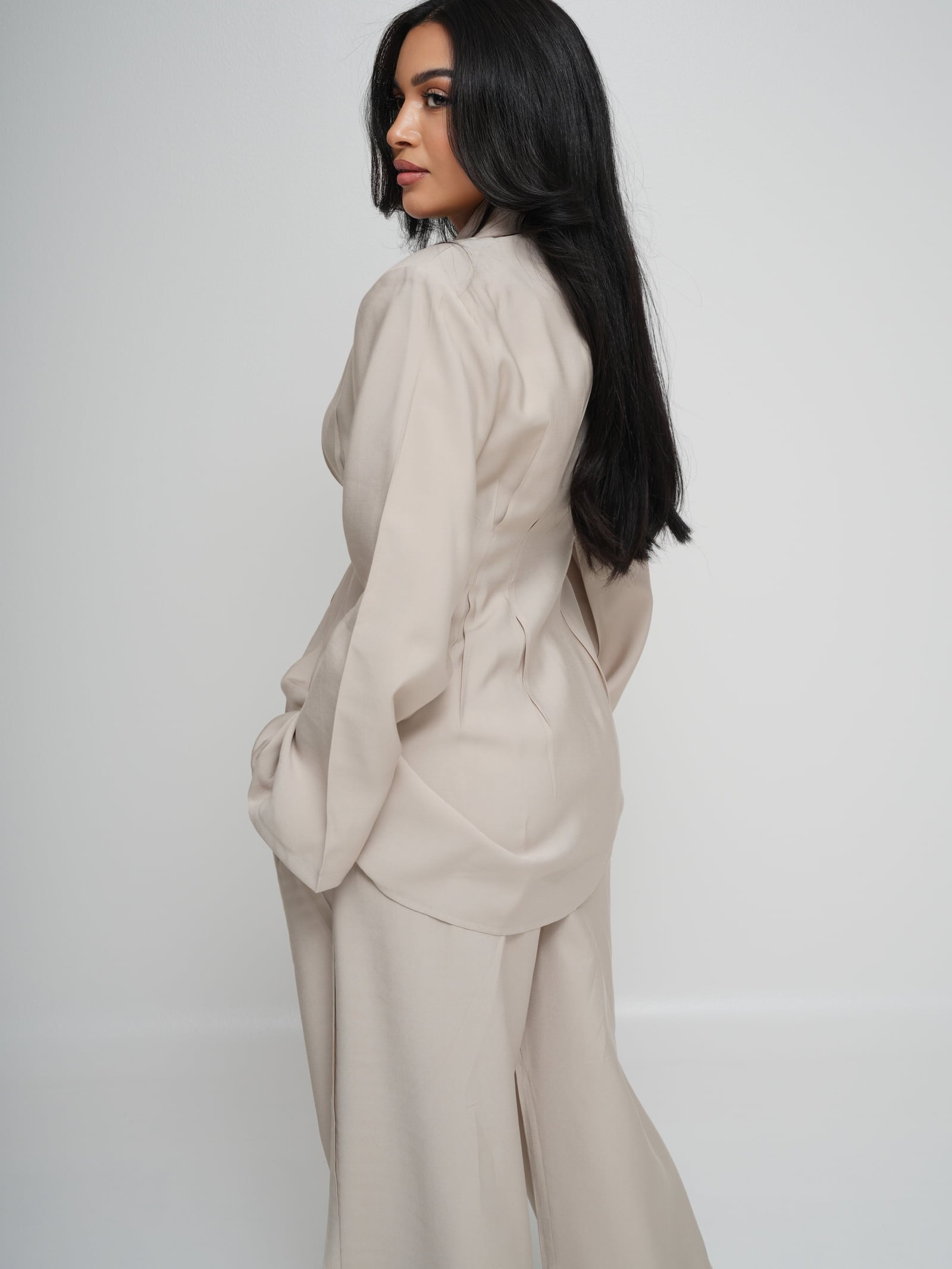 Model wearing the Asymmetric Tencel co-ord set in cream