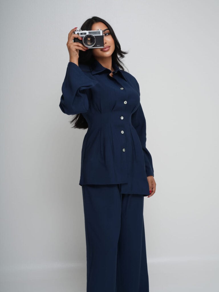 Navy Tencel shirt with an asymmetric hem, worn with matching wide-leg trousers