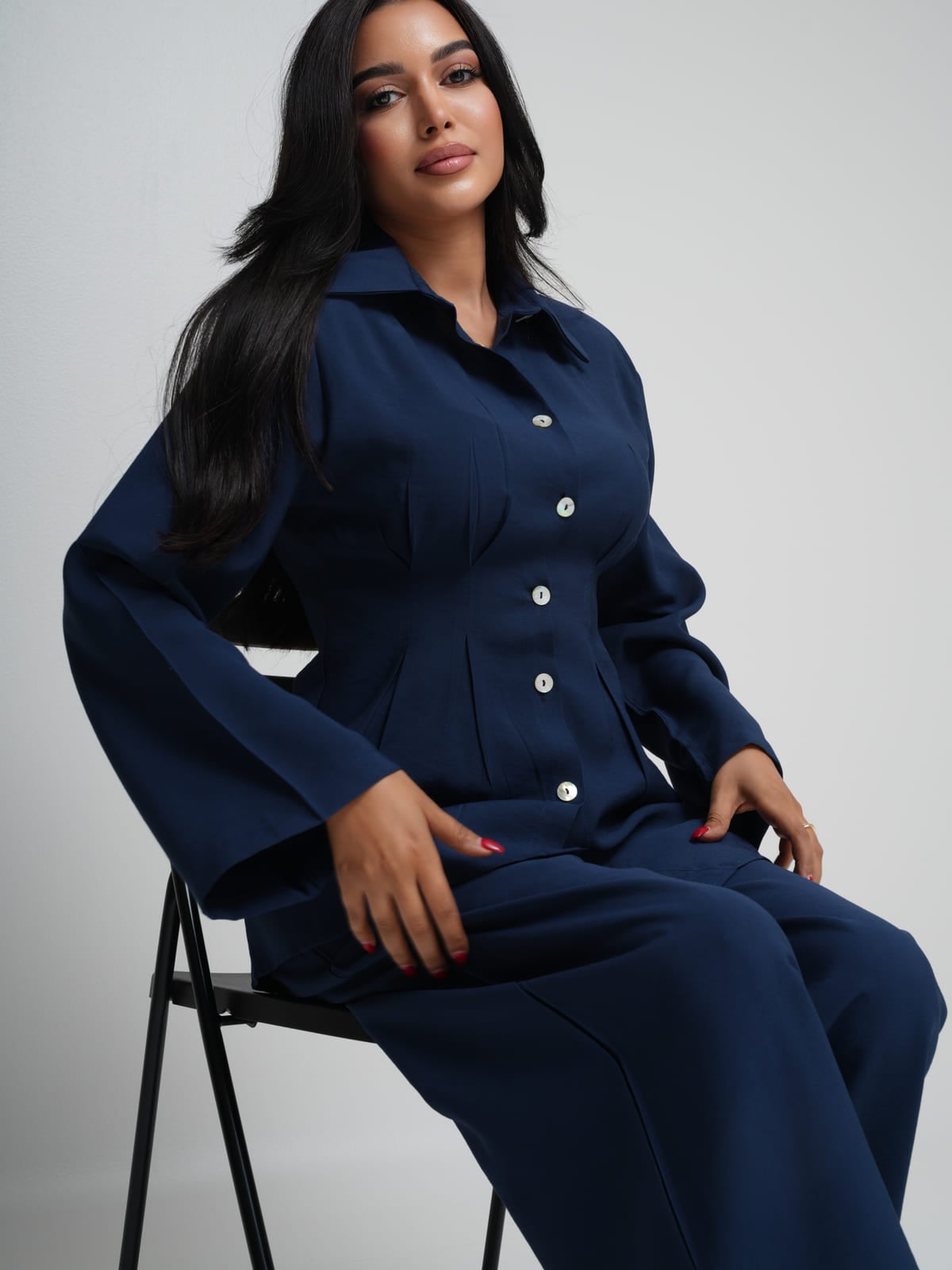Navy Tencel shirt with an asymmetric hem, worn with matching wide-leg trousers