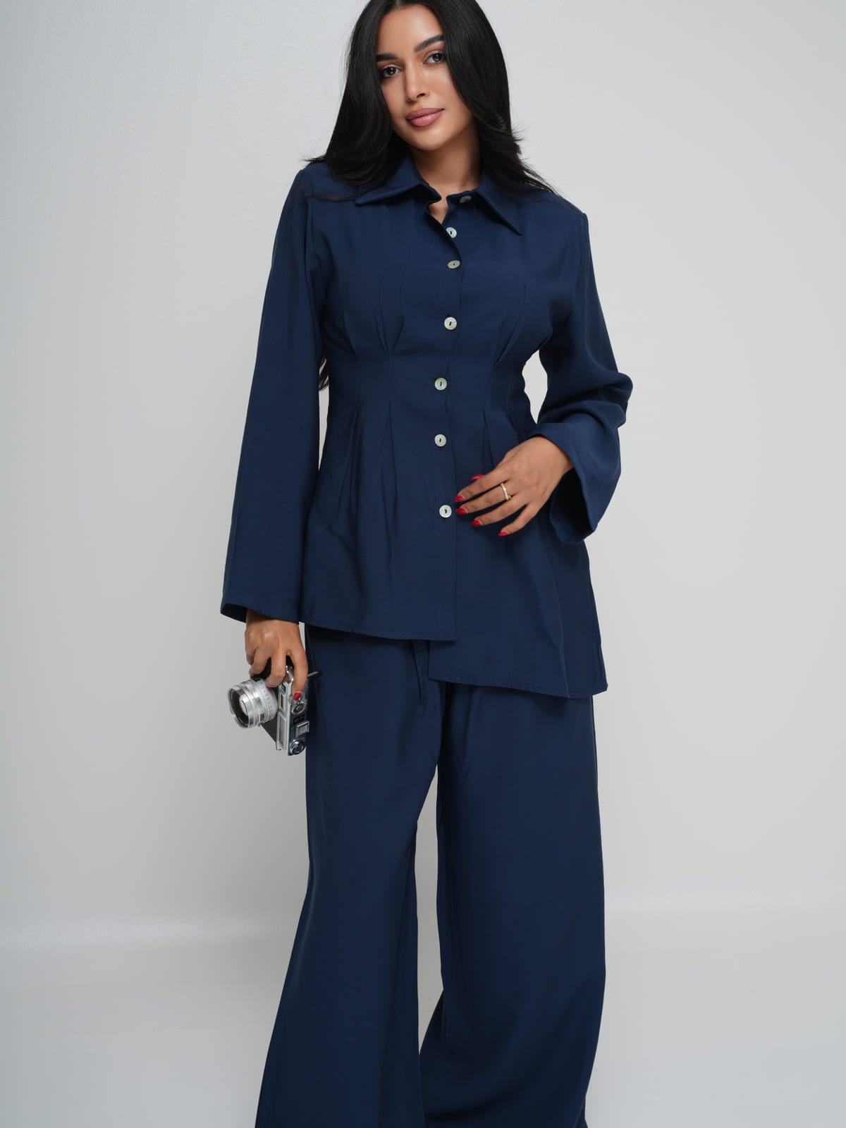 Navy Tencel shirt with an asymmetric hem, worn with matching wide-leg trousers
