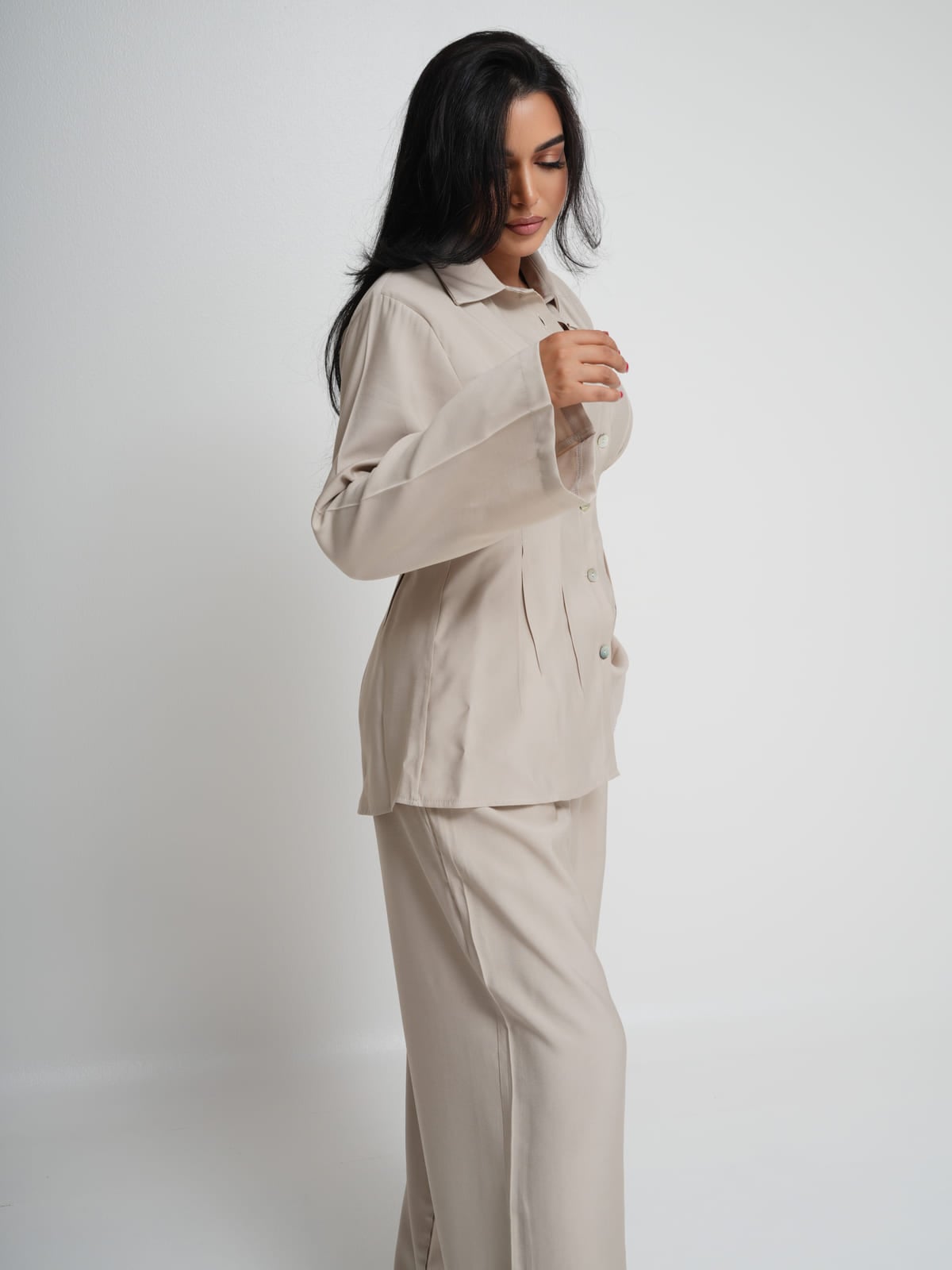 Cream Tencel shirt with structured shoulders and mother-of-pearl buttons, with matching wide-leg trousers