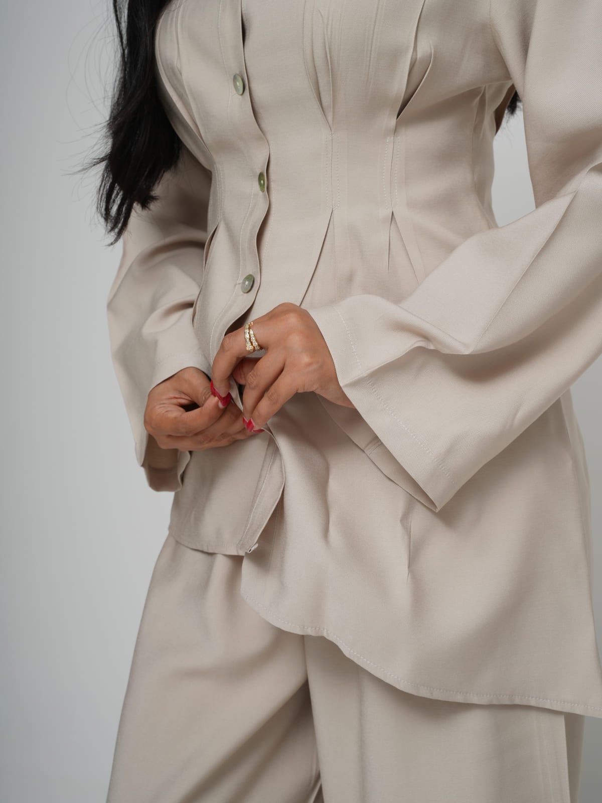 Cream Tencel shirt with structured shoulders and mother-of-pearl buttons, with matching wide-leg trousers