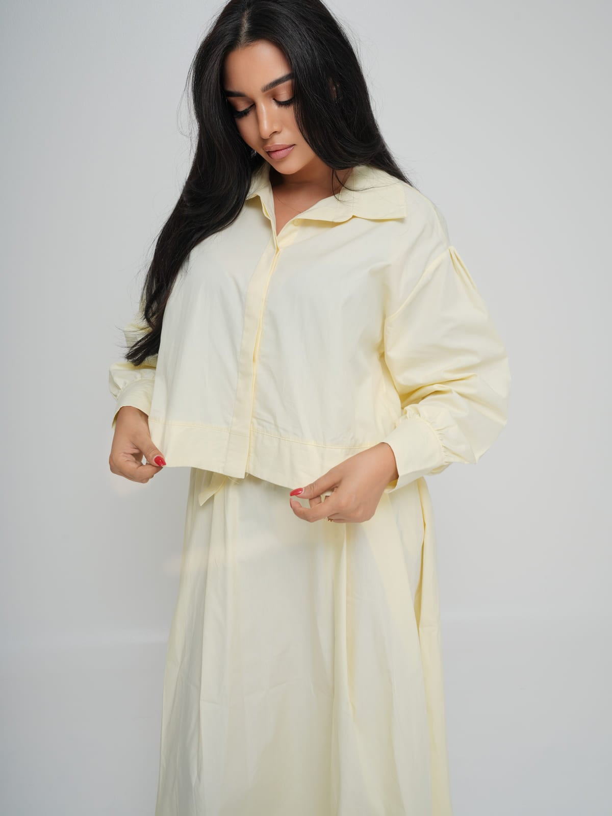 Soft yellow poplin shirt and matching skirt with a gold-hardware belt